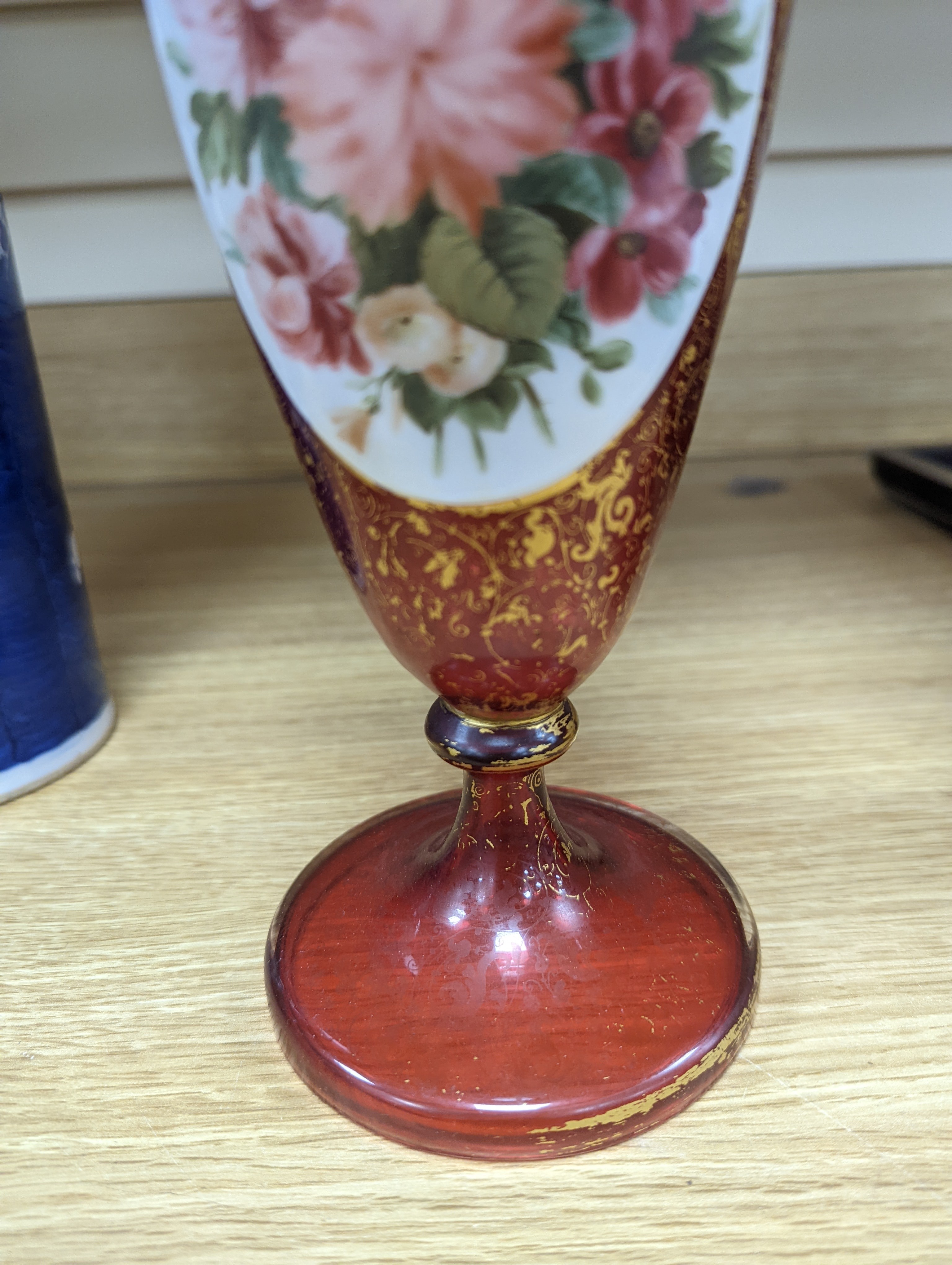 A pair of 19th century Bohemian enamelled and overlaid ruby glass vases 36cm